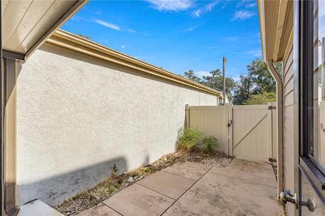 view of side of property featuring a patio