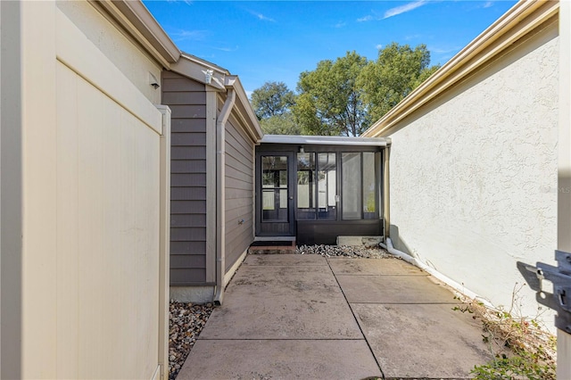 doorway to property with a patio