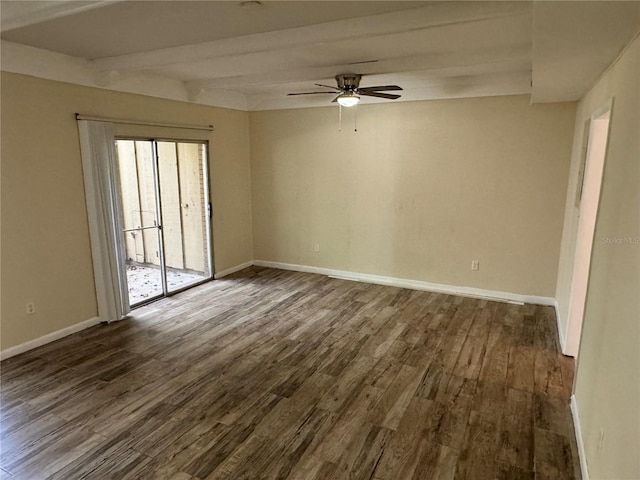 spare room with beam ceiling, dark hardwood / wood-style floors, and ceiling fan