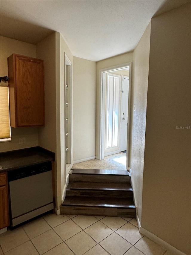 stairway featuring tile patterned floors