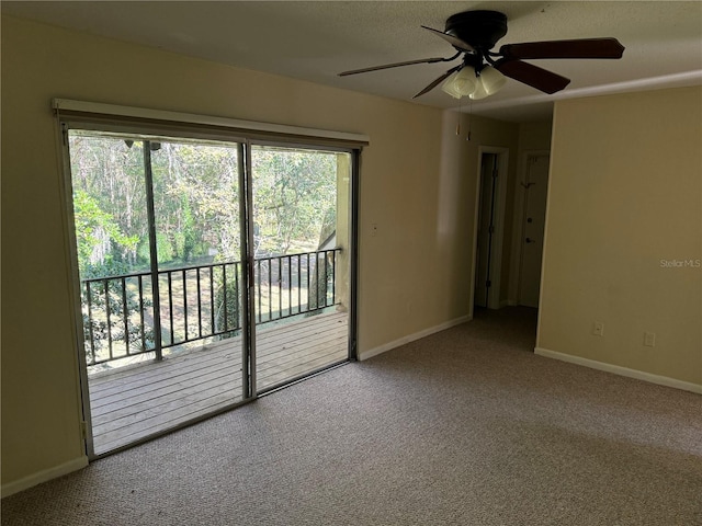 unfurnished room with carpet flooring and ceiling fan