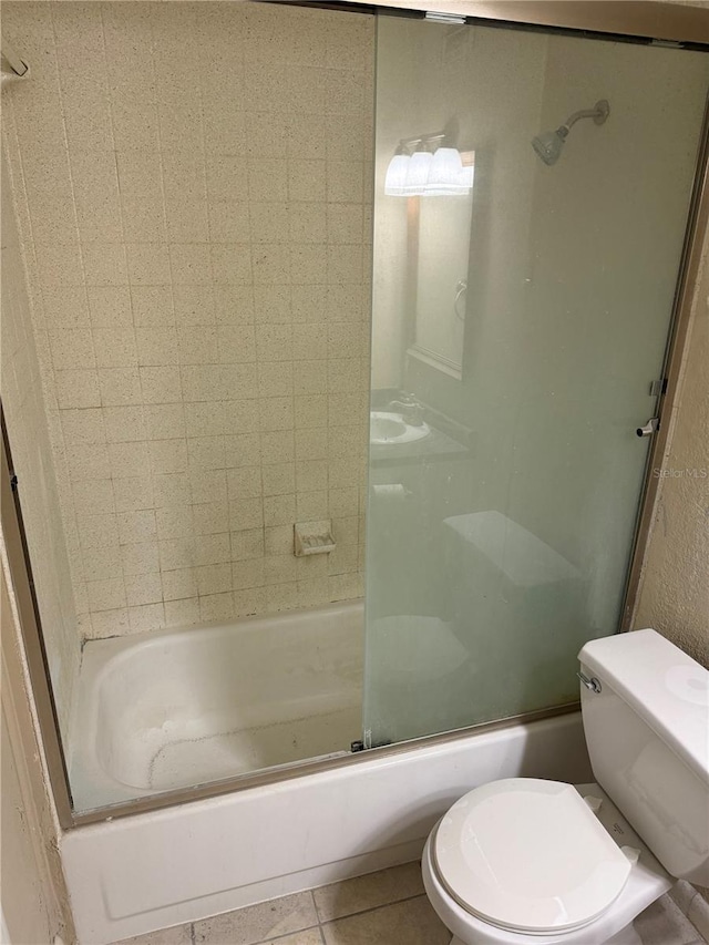 507 NW 39th Rd Unit 159, Gainesville, FL 32607 - bathroom featuring tile patterned floors and shower / bath combination with glass door