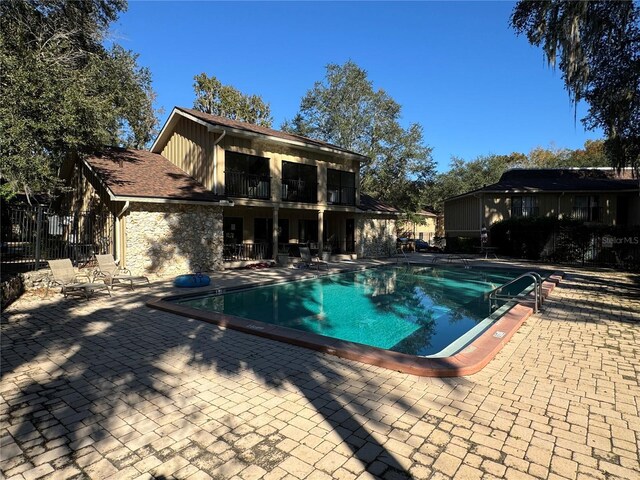 507 NW 39th Rd Unit 159, Gainesville, FL 32607 - community pool with a patio area