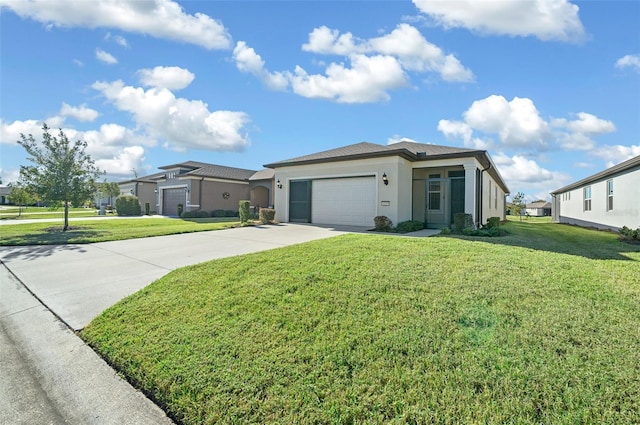 view of front of property with a front yard and a garage