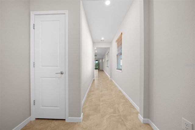 hallway with light tile patterned flooring