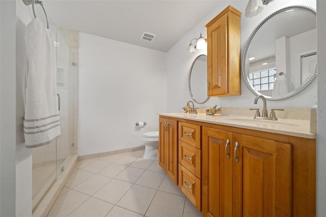 bathroom featuring tile patterned flooring, toilet, a sink, visible vents, and a shower stall