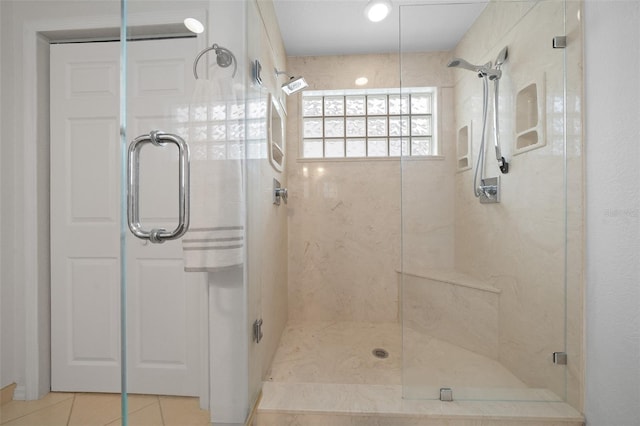 bathroom featuring a stall shower and tile patterned floors