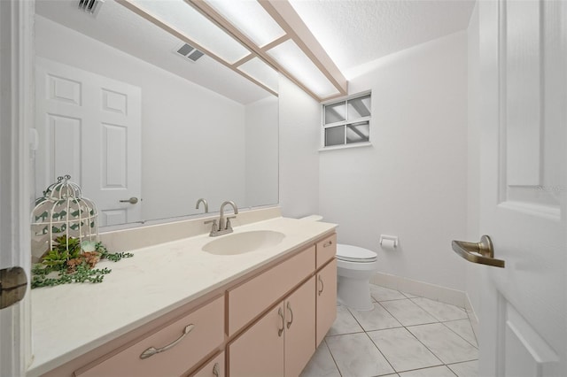 bathroom with visible vents, toilet, vanity, a textured ceiling, and tile patterned flooring