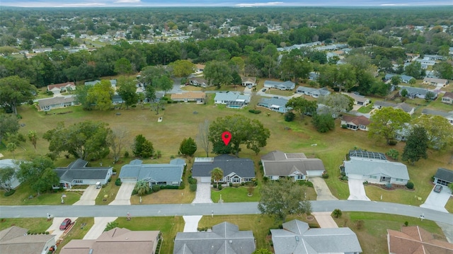 birds eye view of property with a residential view