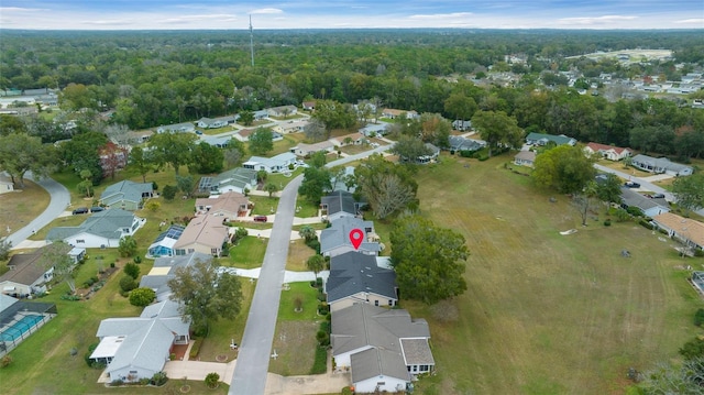 drone / aerial view with a residential view and a forest view