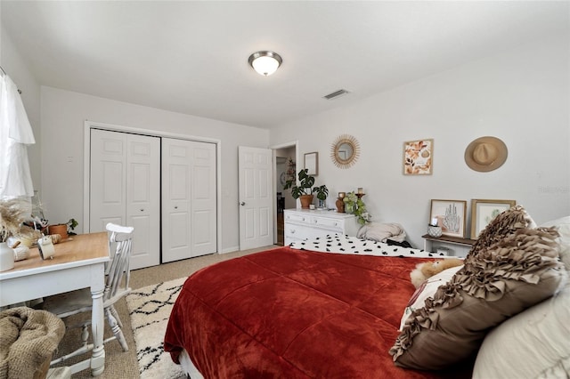 bedroom with light colored carpet and a closet