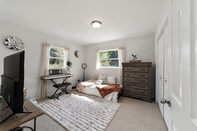 carpeted bedroom featuring a closet