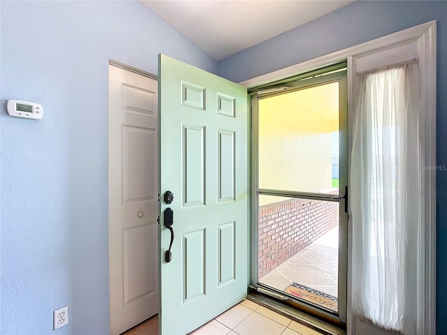 entrance foyer with light tile patterned floors