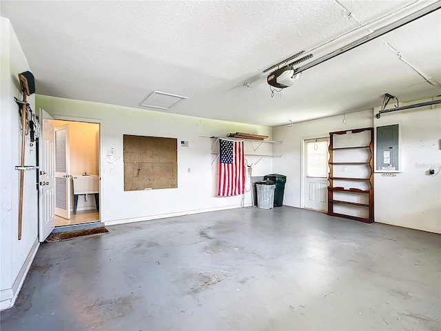 garage with electric panel and a garage door opener