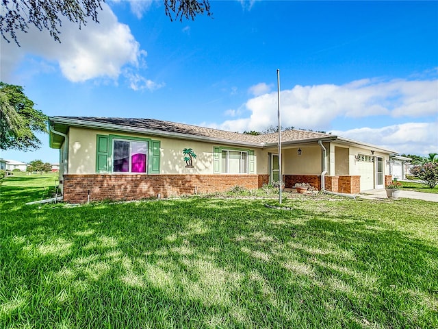 ranch-style home with a garage and a front lawn