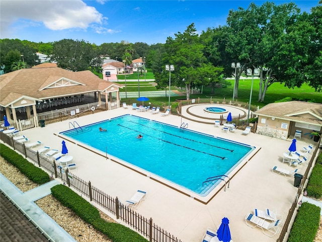 view of swimming pool with a patio