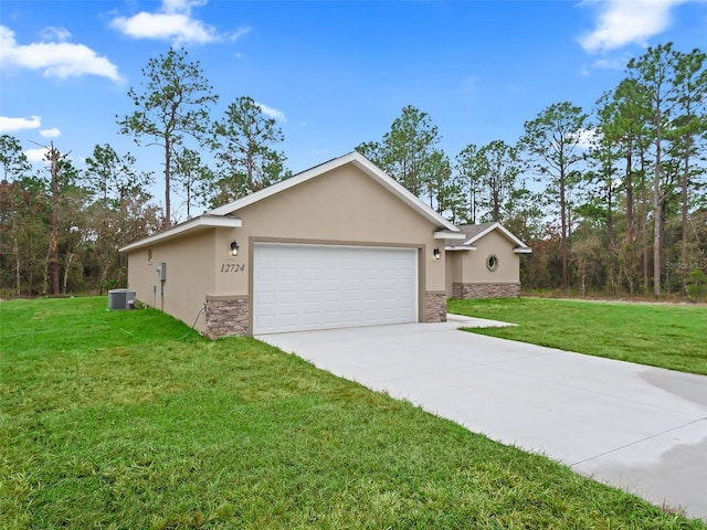 view of front facade featuring central AC unit, a garage, and a front yard