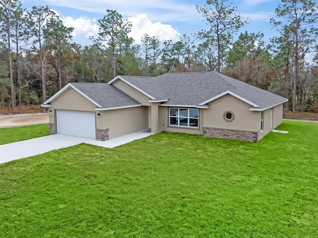 single story home featuring a garage and a front lawn