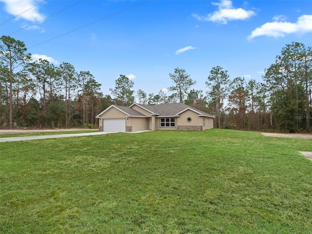 single story home featuring a front lawn and a garage