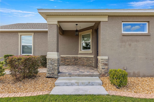 property entrance featuring a porch