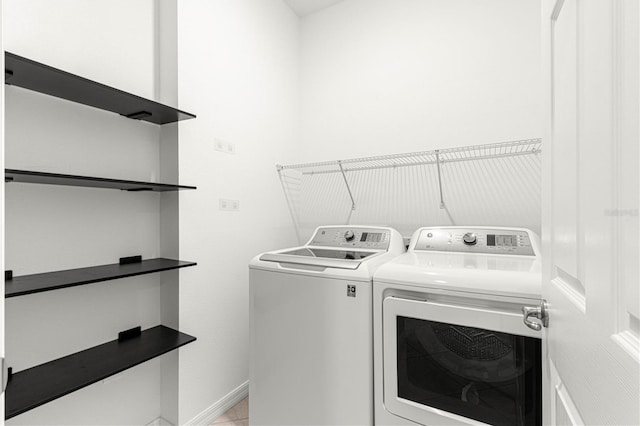 laundry room with washer and dryer