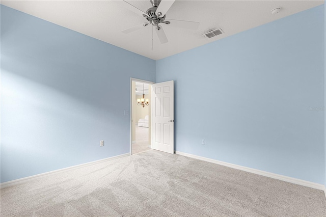 carpeted empty room featuring ceiling fan