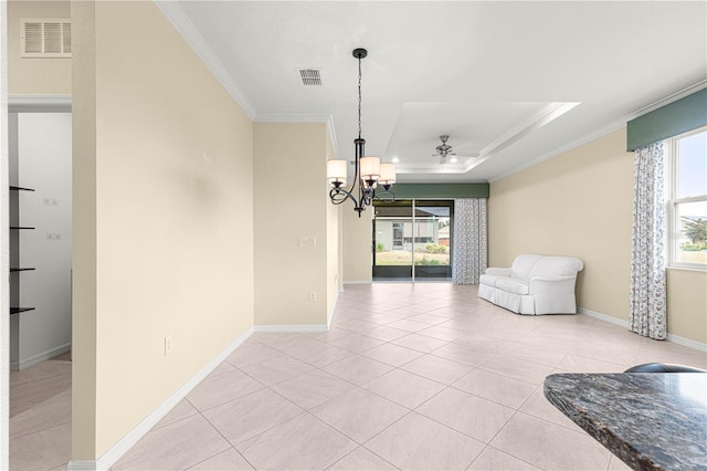 dining space with light tile patterned flooring, a healthy amount of sunlight, and ornamental molding