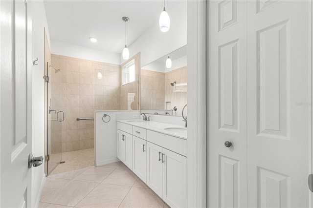 bathroom featuring vanity, tile patterned floors, and an enclosed shower