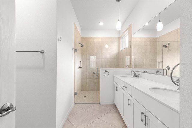 bathroom with tile patterned flooring, vanity, and a shower with shower door