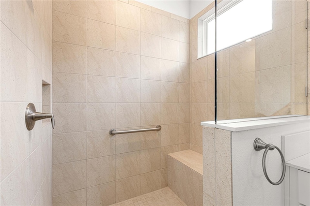 bathroom featuring tiled shower