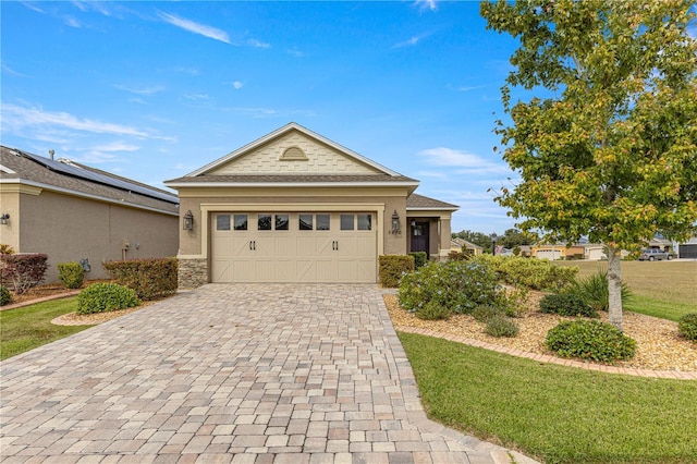 view of front of house with a garage and a front lawn