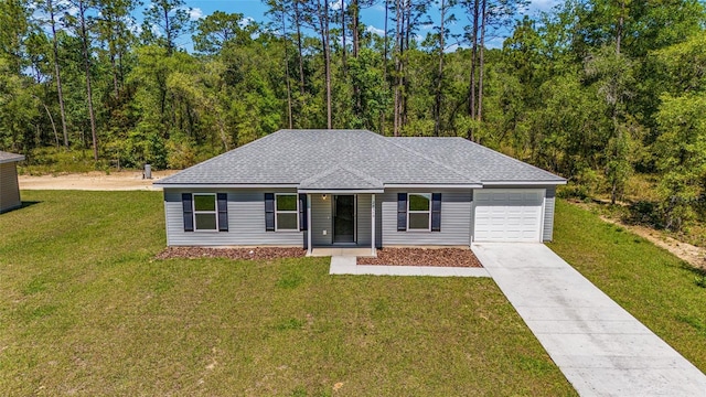 single story home with a garage and a front lawn