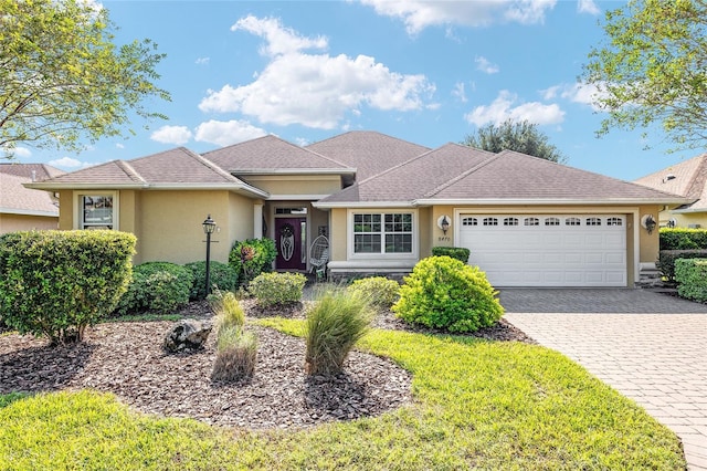 ranch-style house featuring a garage