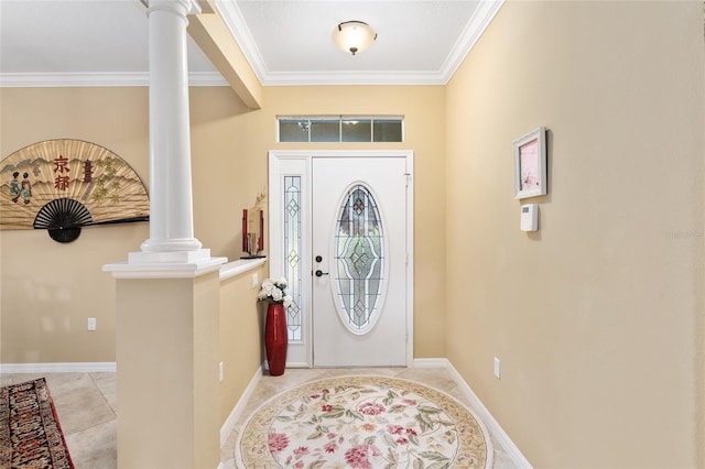 foyer featuring light tile patterned flooring, ornate columns, and crown molding