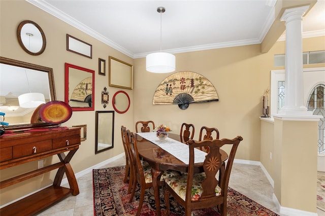 dining room with ornate columns and crown molding