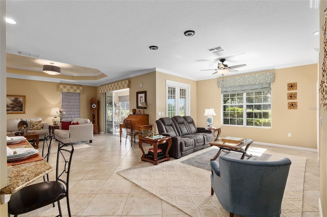 tiled living room featuring ceiling fan and ornamental molding