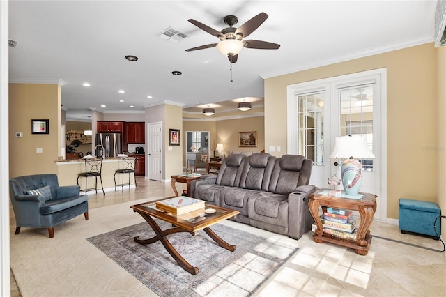 living room with crown molding and ceiling fan