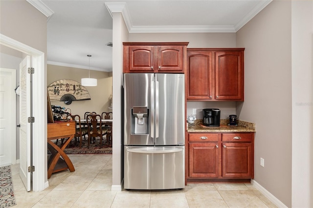 kitchen with decorative light fixtures, stainless steel fridge with ice dispenser, crown molding, and light tile patterned floors