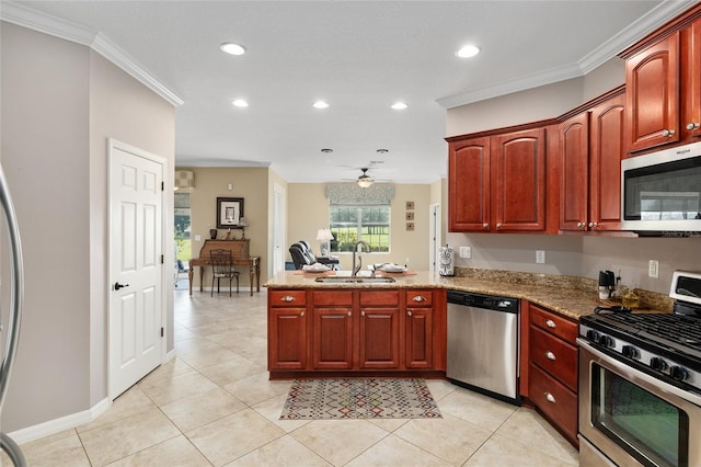 kitchen featuring crown molding, ceiling fan, sink, and stainless steel appliances