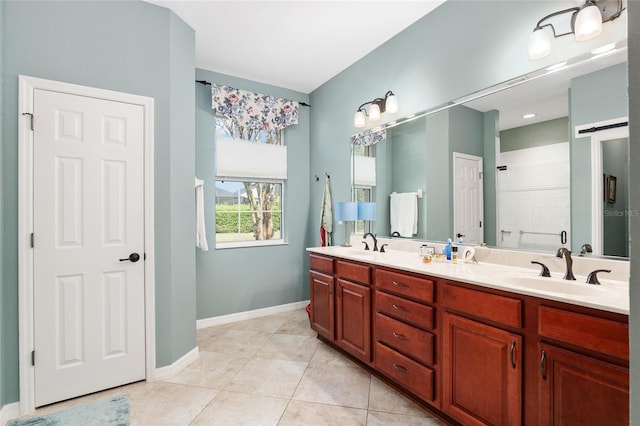 bathroom featuring tile patterned floors, a shower, and vanity