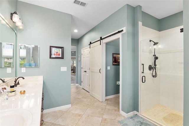 bathroom featuring vanity, tile patterned floors, and walk in shower