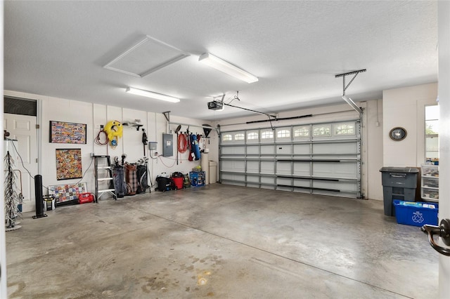 garage featuring a garage door opener and electric panel