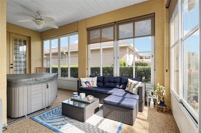 sunroom featuring a jacuzzi and ceiling fan