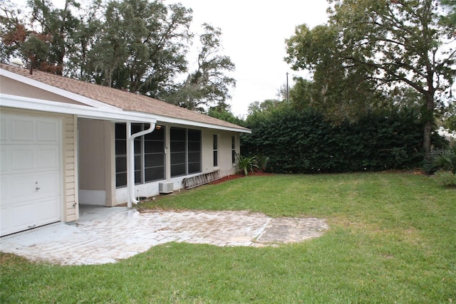 view of yard with a garage