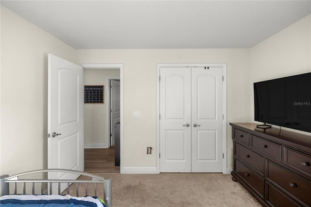 carpeted bedroom with a closet