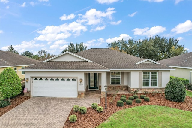 ranch-style home featuring a garage