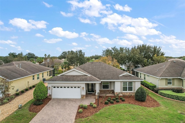 ranch-style house with a garage and a front lawn