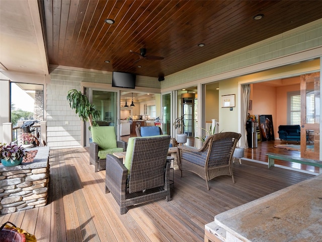 wooden deck with ceiling fan