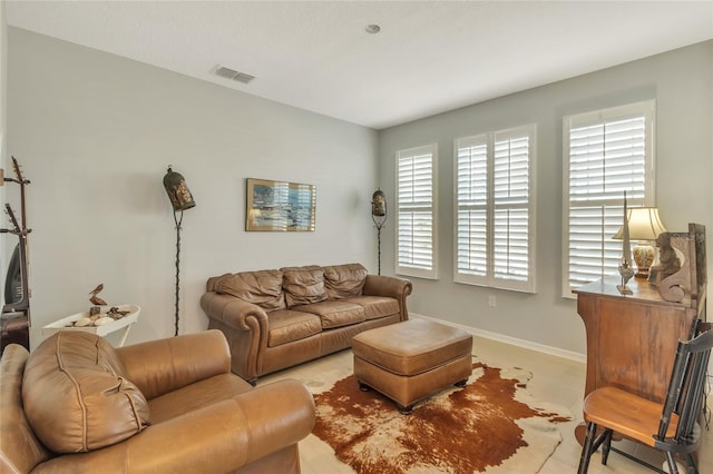 living area featuring visible vents and baseboards