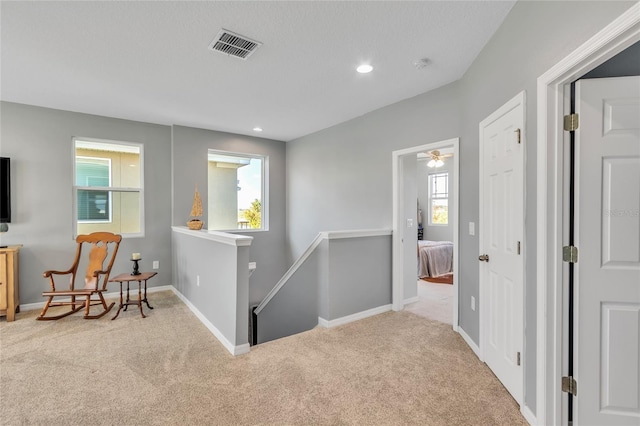 hall featuring an upstairs landing, recessed lighting, baseboards, and carpet floors